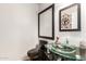 Clean bathroom with modern vanity and glass sink at 1340 S 232Nd Ave, Buckeye, AZ 85326