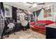 Bedroom with red couch, vanity, and fun decor at 1340 S 232Nd Ave, Buckeye, AZ 85326