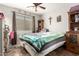 Cozy bedroom with a double bed and built-in shelving at 1340 S 232Nd Ave, Buckeye, AZ 85326