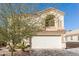 Two-story house with a white garage door and landscaping at 1340 S 232Nd Ave, Buckeye, AZ 85326