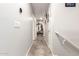 Bright hallway with tiled floors and access to bedrooms at 1340 S 232Nd Ave, Buckeye, AZ 85326