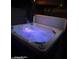 Inviting hot tub featuring multicolored lights perfect for evening relaxation at 1340 S 232Nd Ave, Buckeye, AZ 85326