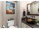 Powder room with a vessel sink and dark granite countertop at 1457 E Copper Holw, Queen Creek, AZ 85140