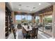 Bright dining room with sliding glass doors leading to a pool and patio at 1457 E Copper Holw, Queen Creek, AZ 85140