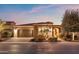 Beautiful desert home with landscaped yard, driveway, and three-car garage at 1457 E Copper Holw, Queen Creek, AZ 85140