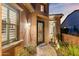 Elegant front entry with ornate door and landscaping at 1457 E Copper Holw, Queen Creek, AZ 85140