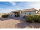 Spacious backyard with covered patio and desert landscaping at 15430 W Amelia Dr, Goodyear, AZ 85395