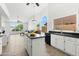 Kitchen with island, granite countertops, and white cabinets at 15430 W Amelia Dr, Goodyear, AZ 85395