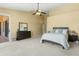 Large main bedroom with ample space and a view of the backyard at 15430 W Amelia Dr, Goodyear, AZ 85395