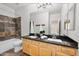 Bathroom with double sinks and stone tile shower at 1723 E Cotton Ct, Gilbert, AZ 85234