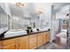 Large bathroom with double vanity and view into bedroom at 1723 E Cotton Ct, Gilbert, AZ 85234