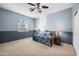 Bedroom with ceiling fan, window, and dark wood flooring at 1723 E Cotton Ct, Gilbert, AZ 85234