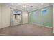 Bright bedroom with neutral walls and carpet, ceiling fan, and window at 1723 E Cotton Ct, Gilbert, AZ 85234