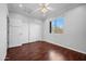 Bedroom with hardwood floors and access to another room at 1723 E Cotton Ct, Gilbert, AZ 85234