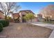 Two-story house with a three-car garage and mature trees at 1723 E Cotton Ct, Gilbert, AZ 85234