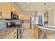 Well-equipped kitchen boasting granite countertops and stainless steel appliances at 1723 E Cotton Ct, Gilbert, AZ 85234