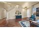 Elegant living room with hardwood floors and a grand staircase at 1723 E Cotton Ct, Gilbert, AZ 85234