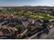 Luxury homes with tile roofs and a golf course backdrop at 17444 N 79Th St, Scottsdale, AZ 85255