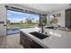 Modern kitchen with expansive view; features large island and sink at 17444 N 79Th St, Scottsdale, AZ 85255