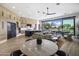 Modern kitchen with island, stainless steel appliances, and views to the backyard at 17444 N 79Th St, Scottsdale, AZ 85255