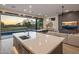 Modern kitchen with island and golf course view at 17444 N 79Th St, Scottsdale, AZ 85255