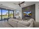 Bright and airy living room with large windows, fireplace, and comfortable seating at 17444 N 79Th St, Scottsdale, AZ 85255