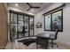 Modern home office with glass partition, desk, and stylish decor at 17444 N 79Th St, Scottsdale, AZ 85255