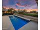 Luxury pool with golf course view at sunset at 17444 N 79Th St, Scottsdale, AZ 85255