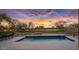 Luxury pool with golf course view at sunset at 17444 N 79Th St, Scottsdale, AZ 85255