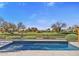 Luxury pool with golf course view; outdoor kitchen and seating area at 17444 N 79Th St, Scottsdale, AZ 85255