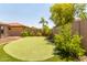 Putting green and manicured landscaping in backyard at 17925 W Mauna Loa Ln, Surprise, AZ 85388