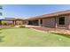 Backyard view showcasing putting green and gazebo at 17925 W Mauna Loa Ln, Surprise, AZ 85388