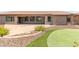 Landscaped backyard featuring a putting green at 17925 W Mauna Loa Ln, Surprise, AZ 85388