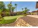 Artificial turf putting green and rock landscaping at 17925 W Mauna Loa Ln, Surprise, AZ 85388