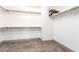 Large walk-in closet with ample shelving at 17925 W Mauna Loa Ln, Surprise, AZ 85388