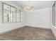 Elegant dining room with a large mirror and modern chandelier at 17925 W Mauna Loa Ln, Surprise, AZ 85388