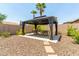 Backyard gazebo with table and seating area at 17925 W Mauna Loa Ln, Surprise, AZ 85388