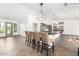 Modern kitchen with an island and stylish barstools at 17925 W Mauna Loa Ln, Surprise, AZ 85388