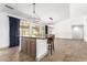 Open kitchen with an island, light-colored cabinetry, and pendant lighting at 17925 W Mauna Loa Ln, Surprise, AZ 85388