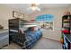 Cozy bedroom with bunk bed, built-in shelving, and a window seat at 1931 W Mulberry Dr, Chandler, AZ 85286