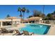 Enjoy this inviting community pool with comfortable lounge chairs and palm trees at 1931 W Mulberry Dr, Chandler, AZ 85286