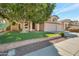 House exterior with two-car garage and manicured lawn at 1931 W Mulberry Dr, Chandler, AZ 85286