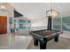 Entryway with a pool table and view into the kitchen at 1931 W Mulberry Dr, Chandler, AZ 85286