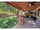 Covered patio with string lights, seating area, and playhouse at 1931 W Mulberry Dr, Chandler, AZ 85286