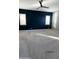 Large bedroom with a navy accent wall and plush carpeting at 20982 E Mockingbird Dr, Queen Creek, AZ 85142