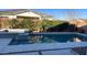 Relaxing backyard pool and spa with stone decking at 20982 E Mockingbird Dr, Queen Creek, AZ 85142