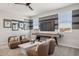 Stylish game room with a pool table, modern seating, striped walls, and plenty of natural light at 21048 N 58Th St, Phoenix, AZ 85054