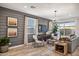 Beautiful living room featuring shiplap walls, modern decor, lots of natural light, and an open floor plan at 21048 N 58Th St, Phoenix, AZ 85054