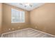 Bright bedroom with neutral walls and carpet flooring at 2331 W Kristina Ave, San Tan Valley, AZ 85144