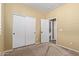 Bedroom with double door closet and bathroom access at 2331 W Kristina Ave, San Tan Valley, AZ 85144